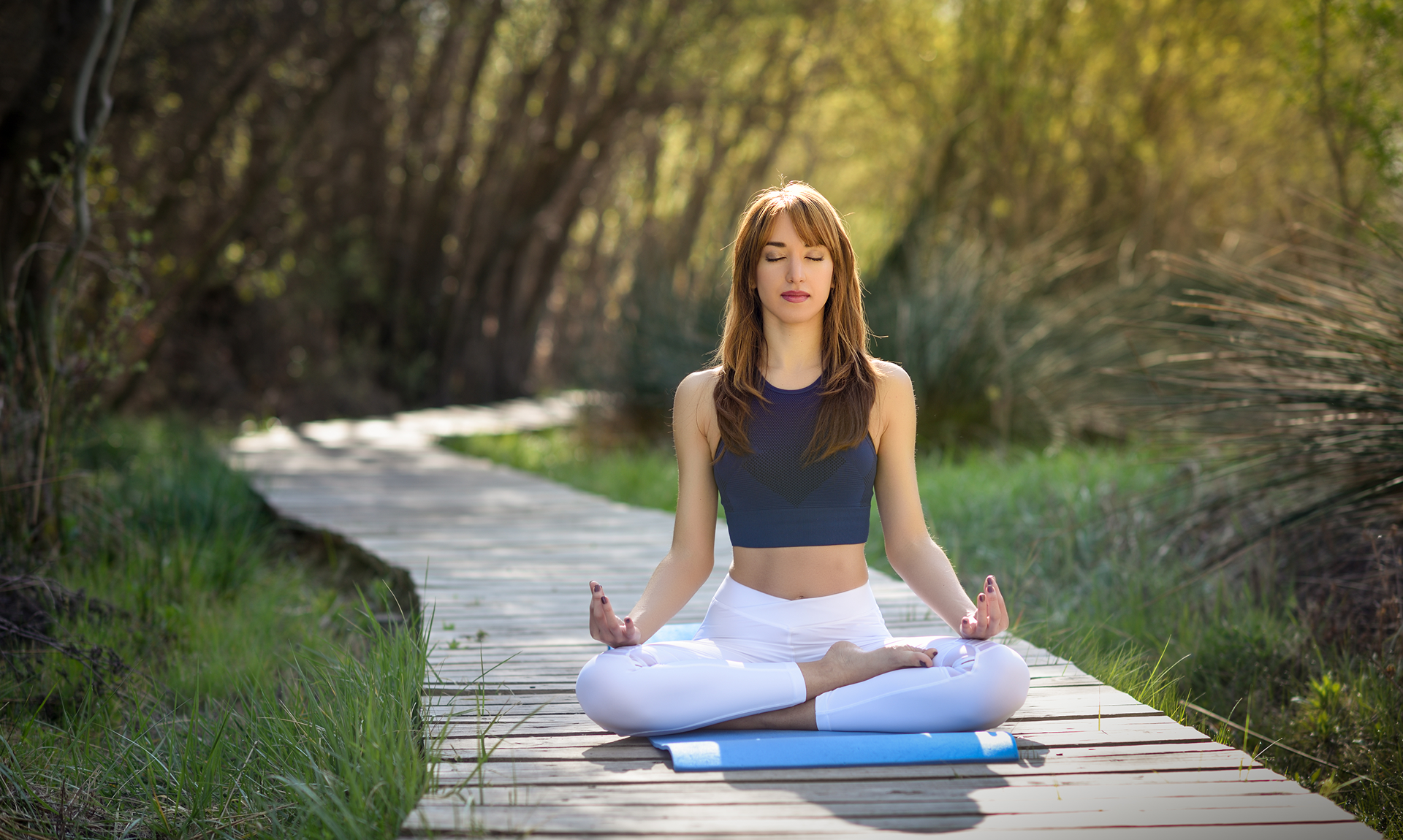 young-beautiful-woman-doing-yoga-nature
