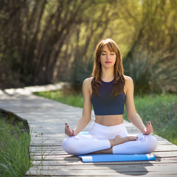 young-beautiful-woman-doing-yoga-nature